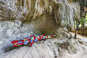 Hiking trail with stuffed animals as sculptures at Phra Nang beach near Krabi