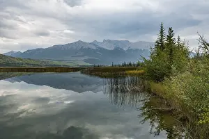 Hilly landscape reflected in a lake