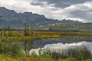 Hilly landscape reflected in a lake