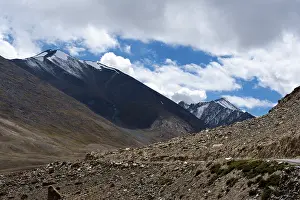 Himalaya high mountain landscape panorama with dramatic cloudy sky near Khardung La pass