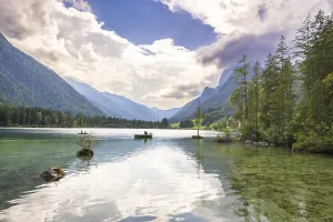 Hintersee with rocks and trees in the foreground