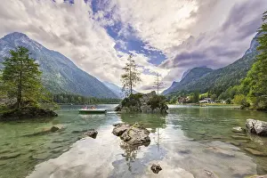 Hintersee with rocks and trees in the foreground