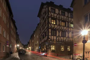 Historic Alstadtstrasse illuminated at night
