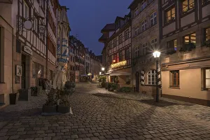 Historic Alstadtstrasse illuminated at night