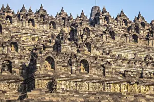 The historic Borobudur temple with its detailed reliefs in Indonesia during daylight
