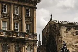 Framed Print : Historic building next to church with intricate stonework under a partly cloudy sky in Newcastle Upon Tyne Framed Print : Historic building next to church with intricate stonework under a partly cloudy sky in Newcastle Upon Tyne