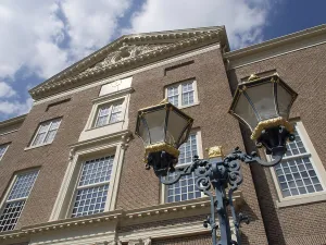 A historic building with large lanterns and a detailed facade
