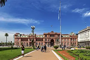 Historic building with surrounding gardens and flag