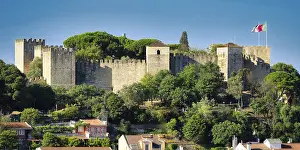 The historic Castelo de Sao fortress in lisbon's alfama district in the warm morning light<br> The historic