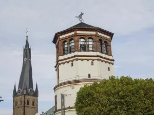 Historic church tower and another tower in a city