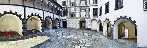 Historic courtyard with paved floor and arcade arches