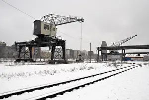 Historic crane on the snow-covered banks of the Main