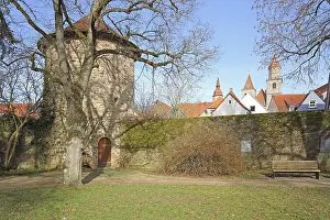 Historic defence defence tower with town wall and towers of collegiate church