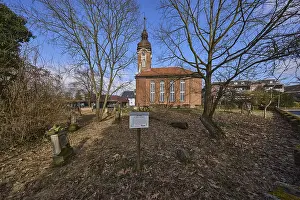Historic gravestone, trees, blue sky