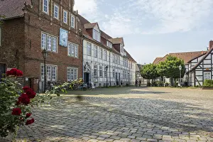Category Cities DE Prints: Historic half-timbered houses with cobbled square and roses
