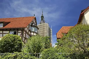 Historic half-timbered houses with views of the Blue Tower