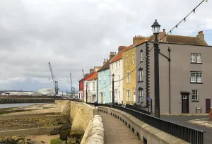 Historic houses overlooking harbour on medieval Town Wall