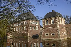 Historic moated castle with impressive reflection in the water