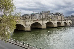 Historic Paris bridge over the river Sena on a cloudy day