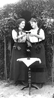 Historic photo, two female friends celebrating with wine