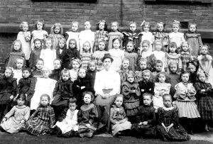 Historic photo, girls school class with teacher