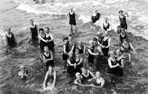 Historic photo, group of bathers dancing in the sea