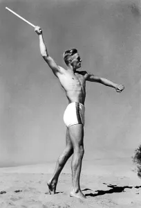 Historic photo, man throwing stick, ca. 1940