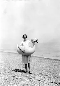 Historic photo, woman at the beach with rubber duck