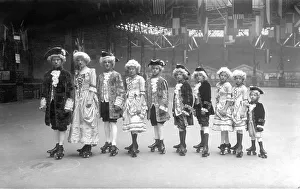 Historic photograph, actors in costume on roller skates