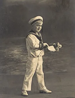 Historic photograph of a boy wearing a sailor's suit