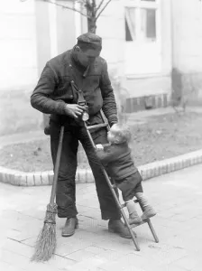 Historic photograph, chimney sweep with child