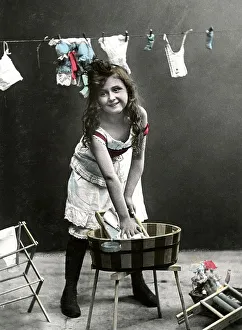 Historic photograph, girl doing laundry