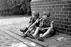 Historic photograph, two girls blowing bubbles