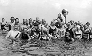 Historic photograph, group of swimmers with a beachball