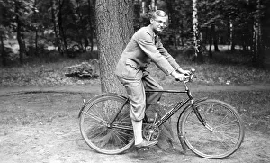 Historic photograph, man on a bicycle, around 1925