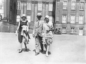 Historic photograph, man and two women out for a stroll