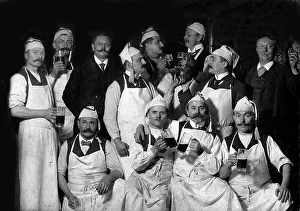 Historic photograph, men in work clothes with beer