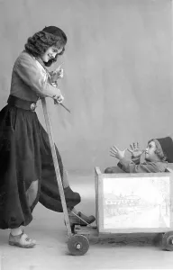 Historic photograph, woman with cheeky child