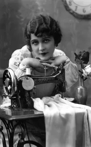 Historic photograph, woman with a sewing machine