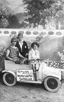 Historic photograph, three women in a cardboard car