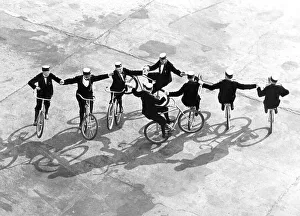 Historic picture, acrobats riding bikes