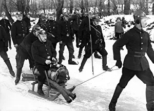 Historic picture, fire brigade with a sledge in ice and snow
