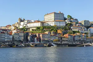 Historic riverside buildings on hillside of Ribeira next to River Douro
