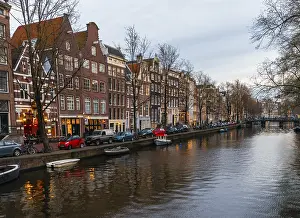 Historic row of houses on a canal at dusk