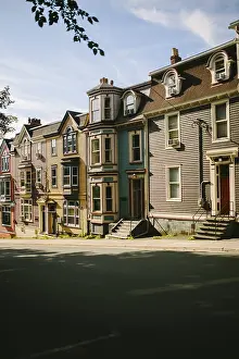 Historic row houses lining a peaceful street in St
