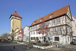 Framed Print : Historic Tubingen Gate built in 1330 and half-timbered house with street shop