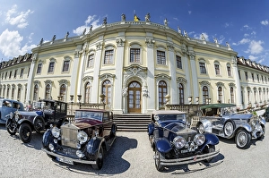 Historic, vintage Rolls-Royce cars are parked in front of Schloss Ludwigsburg Palace