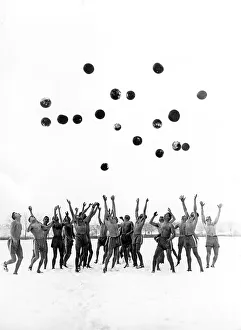Historical image, group of men throwing balls in the air
