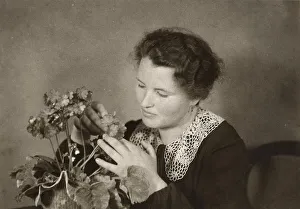 Historical photo, woman arranging flowers
