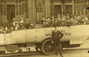 History of the Automobile, tour group in a coach in front of Cologne Cathedral